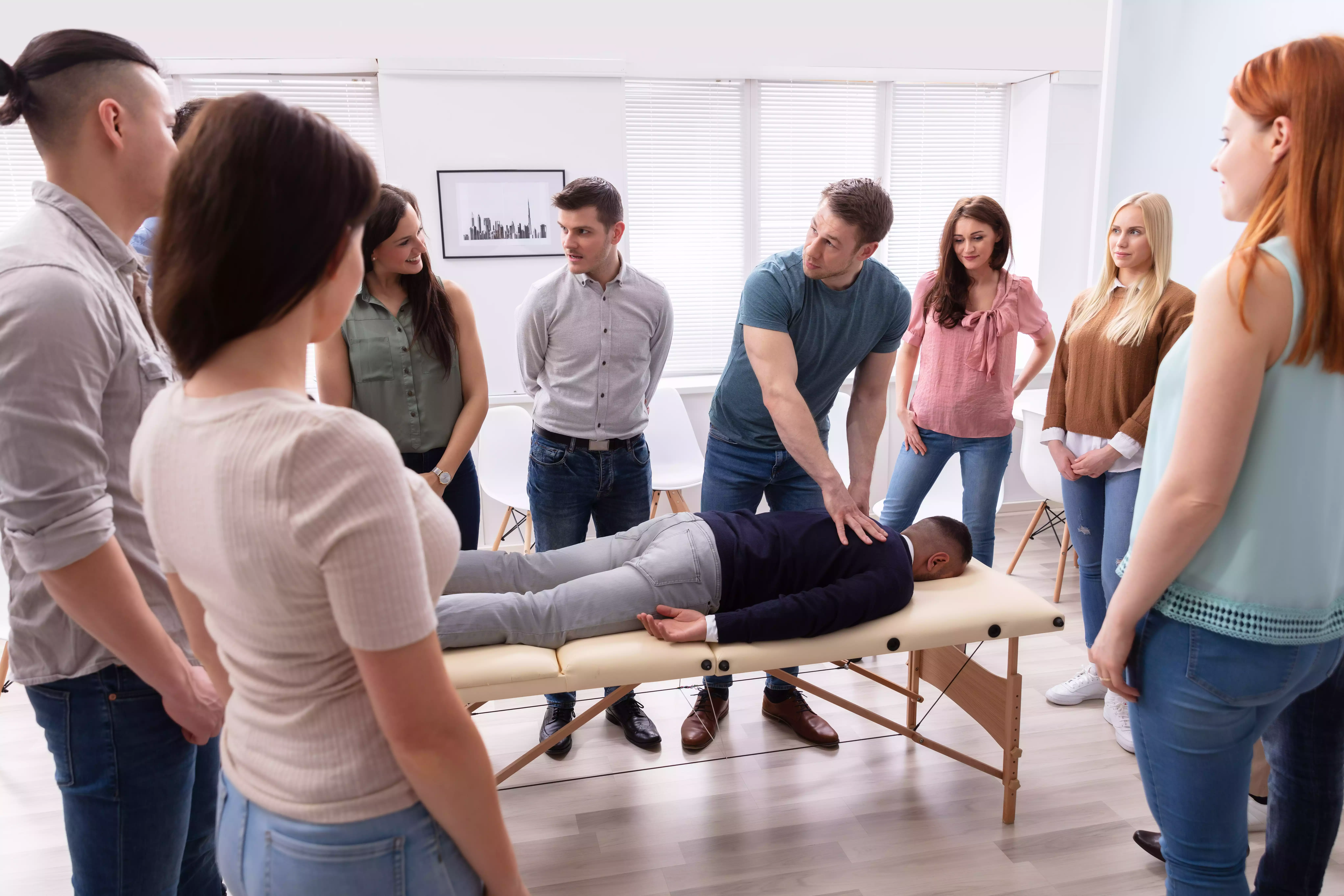 Group of students learning massage